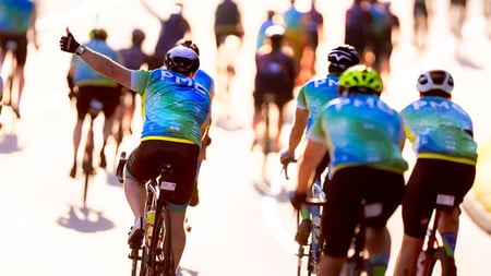 PMC riders riding up a hill during PMC 2025