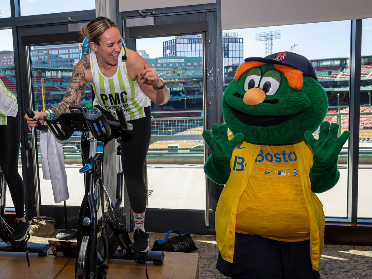 PMC Winter Cycle instructors with Wally the Green Monster at Fenway Park